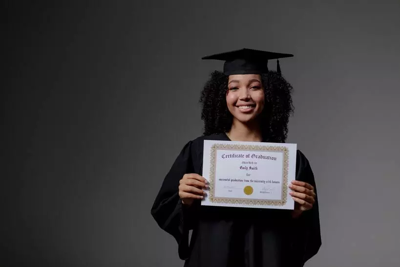 an image of CNA holding her Georgia CNA certificate